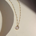 TKN Beaded Mother of Pearl Cross Necklace